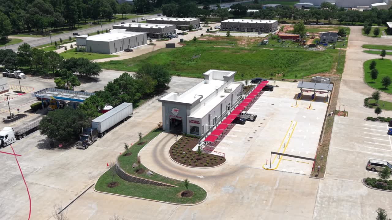 Aerial view of Jet Stream Express Wash and its red-covered vacuum bays in Conroe